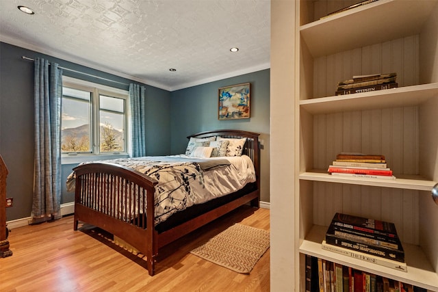 445 Sapphire Ln, Stevensville, MT 59870 - bedroom featuring wood finished floors, recessed lighting, and a textured ceiling