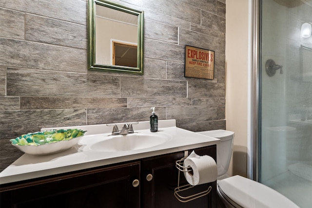 445 Sapphire Ln, Stevensville, MT 59870 - bathroom with vanity, a shower stall, and tasteful backsplash