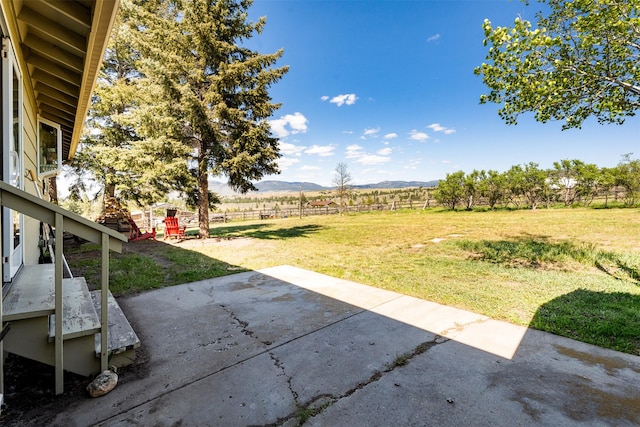 445 Sapphire Ln, Stevensville, MT 59870 - view of yard with a patio area, a mountain view, and a view of rural / pastoral area