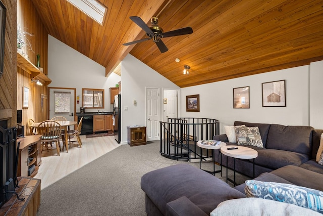 74 Limber Pne, Whitefish, MT 59937 - living room featuring ceiling fan, a skylight, high vaulted ceiling, wooden ceiling, and light colored carpet