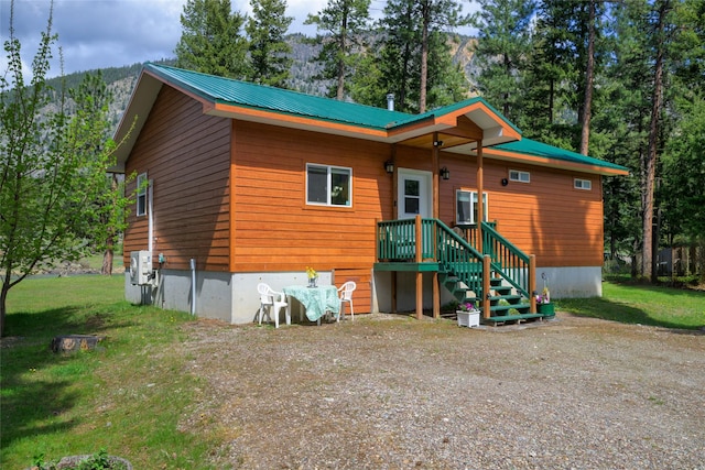 1500 River Rd W, Plains, MT 59859 - view of front facade featuring metal roof, a front yard, and a mountain view