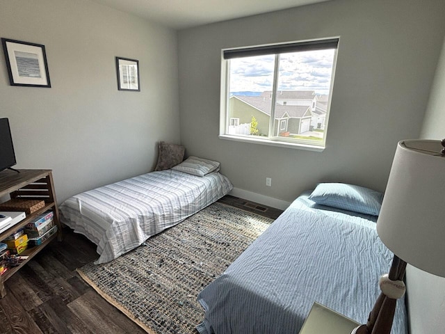 2195 Black Bird Ln, Kalispell, MT 59901 - bedroom with wood finished floors and baseboards