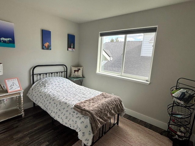 2195 Black Bird Ln, Kalispell, MT 59901 - bedroom with baseboards and wood finished floors