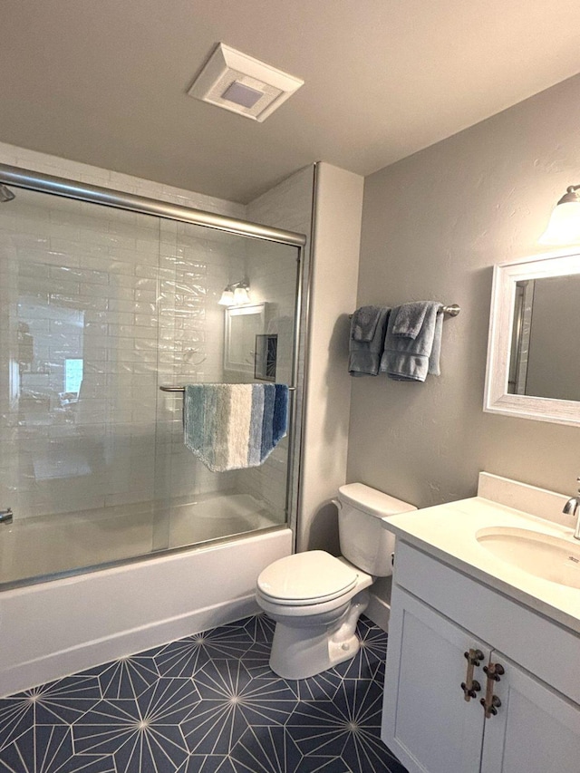 2195 Black Bird Ln, Kalispell, MT 59901 - full bathroom with vanity, combined bath / shower with glass door, and tile patterned floors