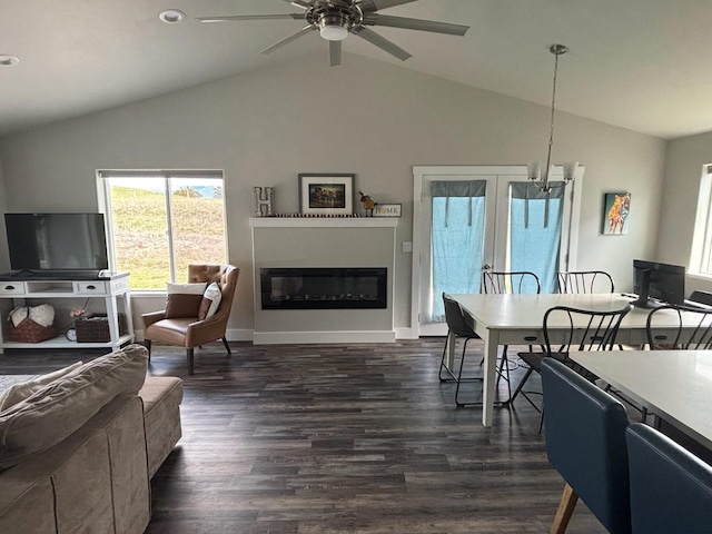 2195 Black Bird Ln, Kalispell, MT 59901 - living room with lofted ceiling, a ceiling fan, a glass covered fireplace, and dark wood finished floors