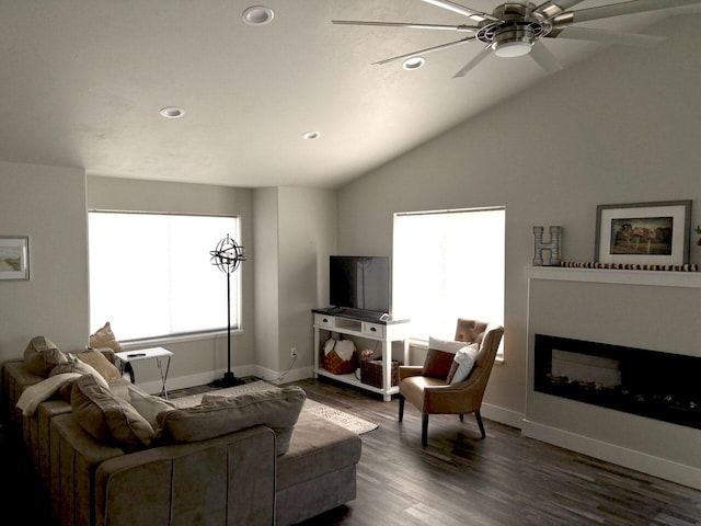 2195 Black Bird Ln, Kalispell, MT 59901 - living room with recessed lighting, dark wood-style flooring, a ceiling fan, vaulted ceiling, and a glass covered fireplace