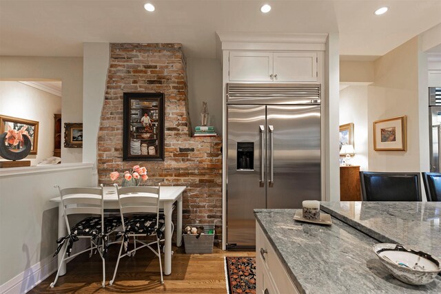 145 E Beckwith Ave, Missoula, MT 59801 - kitchen with stainless steel built in refrigerator, stone countertops, light wood-style floors, white cabinetry, and recessed lighting