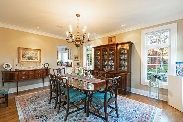 145 E Beckwith Ave, Missoula, MT 59801 - dining room with a chandelier, healthy amount of natural light, baseboards, wood finished floors, and crown molding