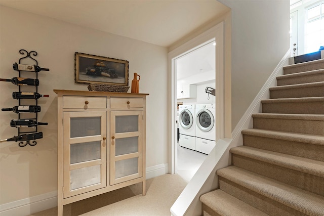 145 E Beckwith Ave, Missoula, MT 59801 - clothes washing area featuring independent washer and dryer, carpet floors, baseboards, and cabinet space