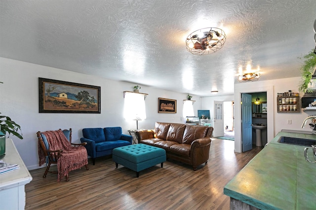 4358 Charlotte Way, Stevensville, MT 59870 - living room with dark wood-type flooring and a textured ceiling