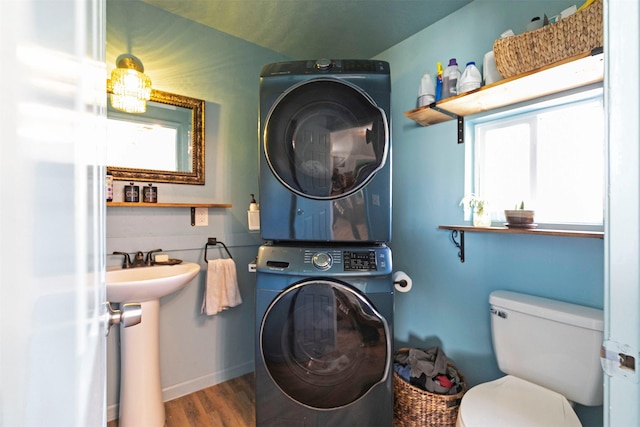 4358 Charlotte Way, Stevensville, MT 59870 - bathroom featuring stacked washer / dryer, wood finished floors, and healthy amount of natural light