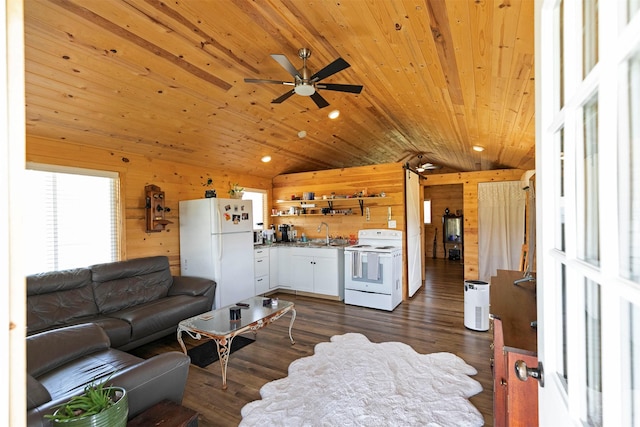 4358 Charlotte Way, Stevensville, MT 59870 - living room featuring wood walls, lofted ceiling, ceiling fan, dark wood-style flooring, and wood ceiling