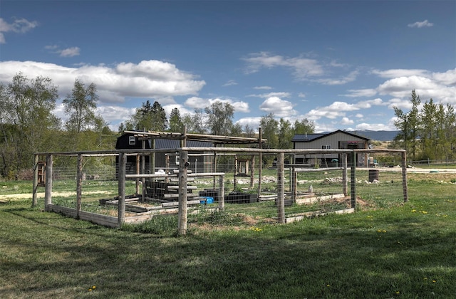 4358 Charlotte Way, Stevensville, MT 59870 - view of playground featuring an outbuilding and a vegetable garden