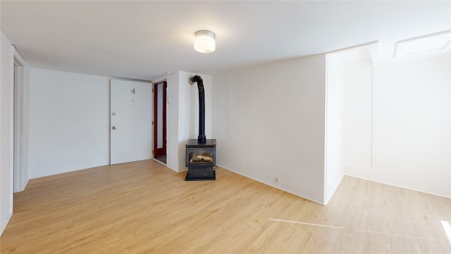 29 3rd Ave E, Kalispell, MT 59901 - spare room with a wood stove and light wood finished floors
