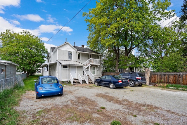 29 3rd Ave E, Kalispell, MT 59901 - colonial inspired home featuring a chimney and stairs