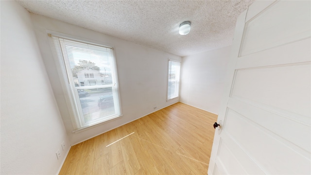 29 3rd Ave E, Kalispell, MT 59901 - spare room featuring a textured ceiling and light wood-style floors