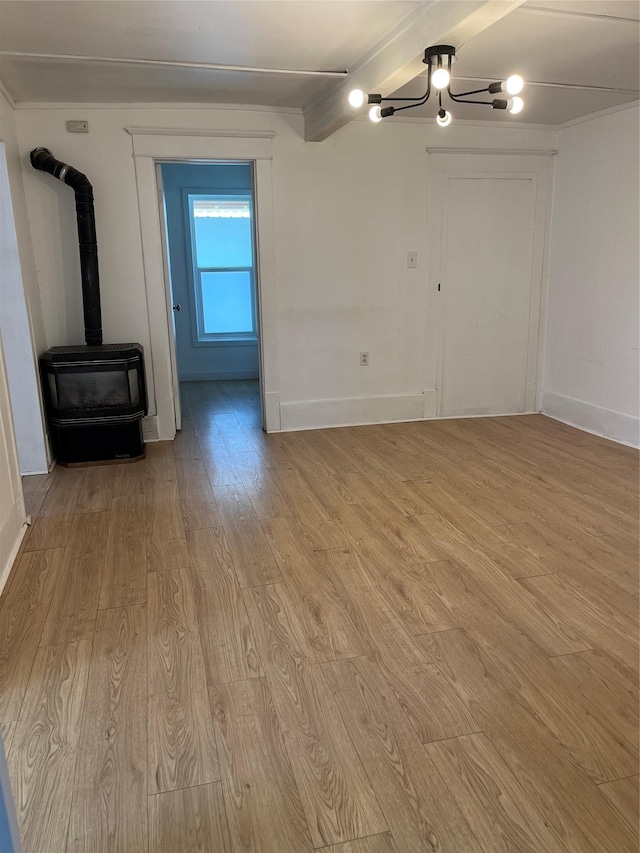 29 3rd Ave E, Kalispell, MT 59901 - unfurnished living room featuring light wood-type flooring and a wood stove