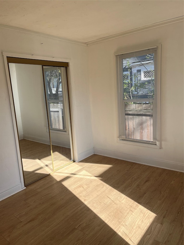 29 3rd Ave E, Kalispell, MT 59901 - unfurnished room featuring wood finished floors and ornamental molding