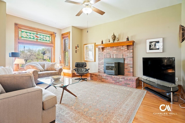 202 Blake St, Helena, MT 59601 - living room featuring wood finished floors, a fireplace, a ceiling fan, and baseboards