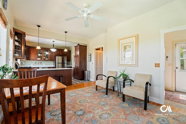 202 Blake St, Helena, MT 59601 - dining space featuring a ceiling fan, baseboards, and light wood-style floors