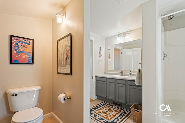 202 Blake St, Helena, MT 59601 - full bathroom featuring toilet, baseboards, and vanity