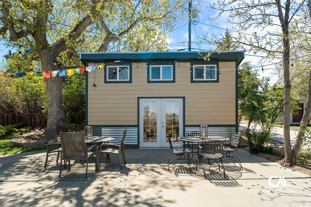 202 Blake St, Helena, MT 59601 - rear view of property featuring french doors, outdoor dining space, and a patio area