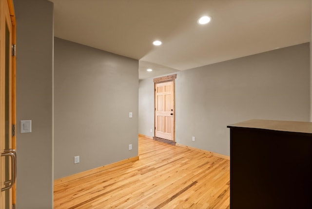 spare room with light wood-style flooring and recessed lighting