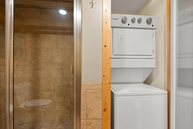laundry area featuring stacked washing machine and dryer