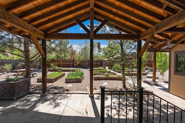 view of patio / terrace with a garden and a fenced backyard