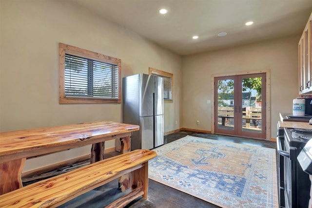 kitchen featuring wooden counters, electric range, french doors, recessed lighting, and freestanding refrigerator