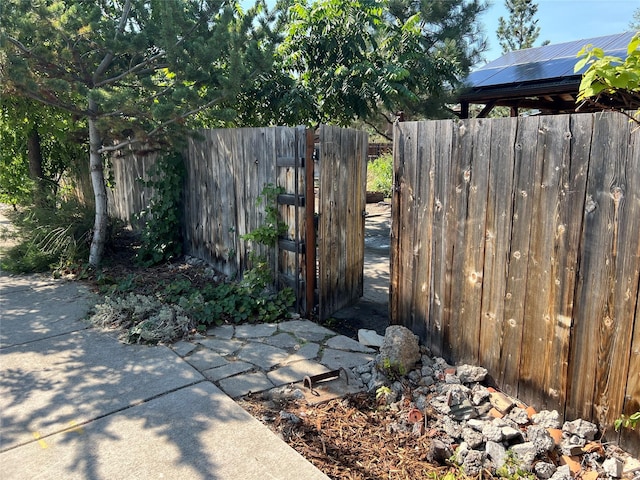 view of yard with fence and a gate