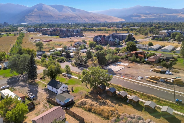 aerial view of property's location with a mountain backdrop