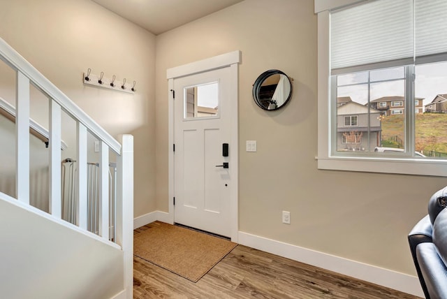 7047 Shaver Dr Unit B, Missoula, MT 59803 - entryway featuring baseboards, wood finished floors, and stairs