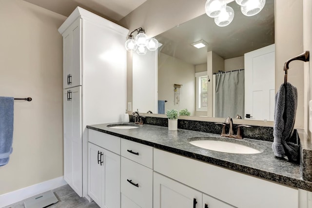 7047 Shaver Dr Unit B, Missoula, MT 59803 - full bath with tile patterned floors, double vanity, and baseboards