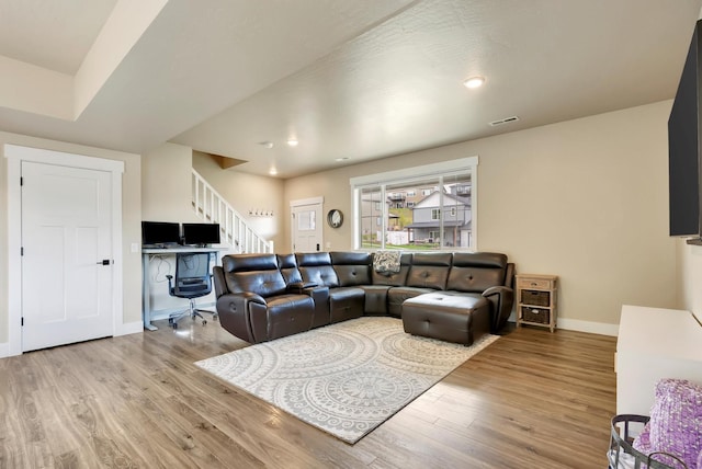 7047 Shaver Dr Unit B, Missoula, MT 59803 - living area with wood finished floors, baseboards, stairway, and a desk