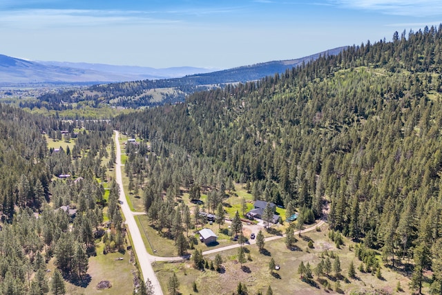 11327 Sleeman Ln, Lolo, MT 59847 - view of property location featuring a heavily wooded area and a mountainous background