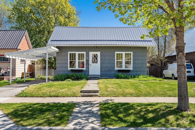 427 Somers Ave, Whitefish, MT 59937 - bungalow-style house featuring driveway, a metal roof, and a carport