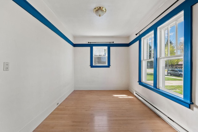 427 Somers Ave, Whitefish, MT 59937 - spare room with baseboard heating and wood-type flooring