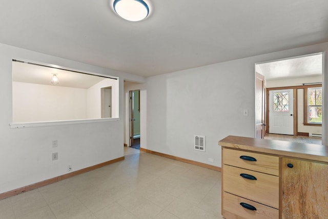 427 Somers Ave, Whitefish, MT 59937 - unfurnished room with light floors and baseboard heating