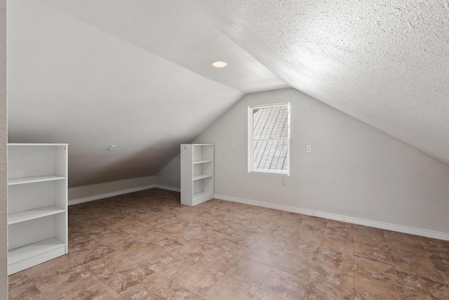 427 Somers Ave, Whitefish, MT 59937 - bonus room with lofted ceiling and a textured ceiling