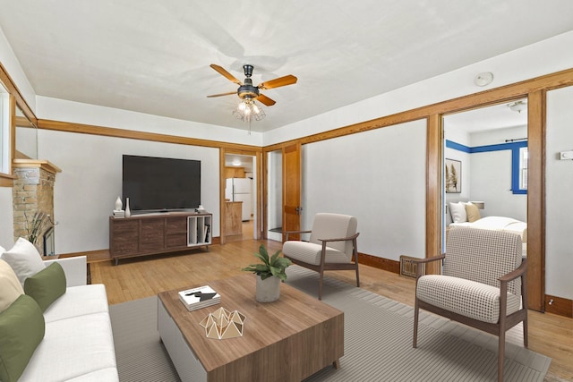 427 Somers Ave, Whitefish, MT 59937 - living room with a ceiling fan and light wood finished floors