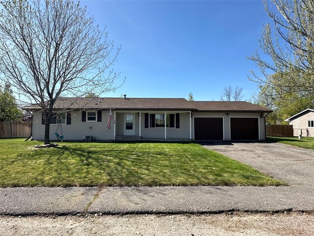 146 New Meadows Dr, Missoula, MT 59808 - ranch-style home with a garage and driveway