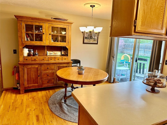146 New Meadows Dr, Missoula, MT 59808 - dining room featuring a chandelier and light wood-type flooring