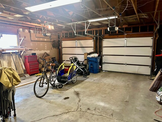 146 New Meadows Dr, Missoula, MT 59808 - garage featuring a garage door opener