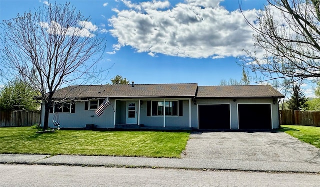 146 New Meadows Dr, Missoula, MT 59808 - single story home featuring an attached garage and asphalt driveway