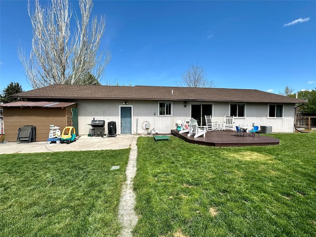 146 New Meadows Dr, Missoula, MT 59808 - back of property with a deck, a yard, and a patio area