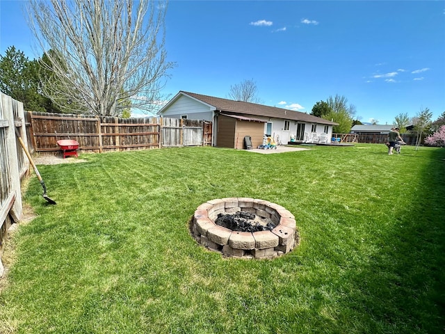146 New Meadows Dr, Missoula, MT 59808 - fenced backyard featuring a fire pit