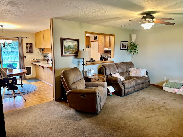 146 New Meadows Dr, Missoula, MT 59808 - living room with light carpet, a chandelier, a ceiling fan, and a textured ceiling