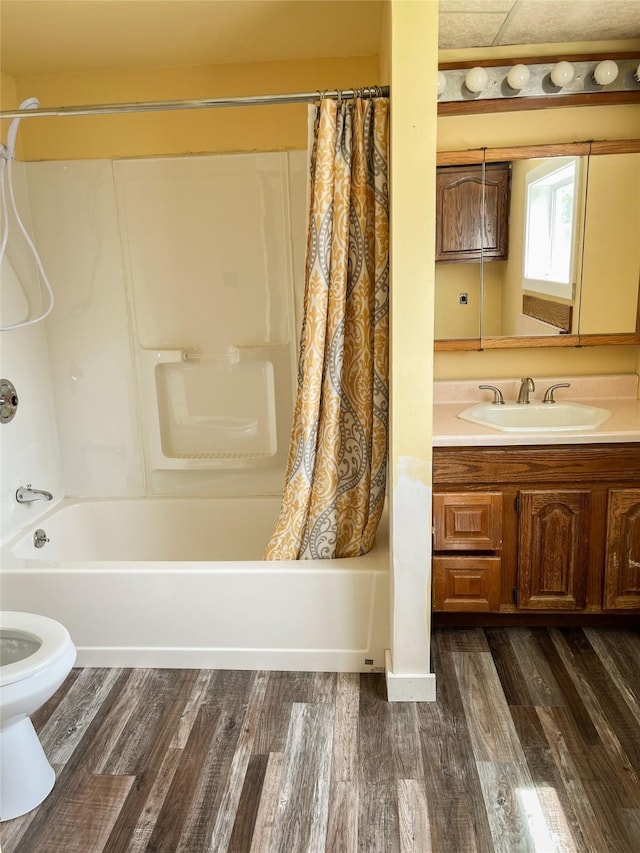 613 Minnesota Ave, Libby, MT 59923 - full bathroom featuring shower / bath combination with curtain, vanity, and wood finished floors