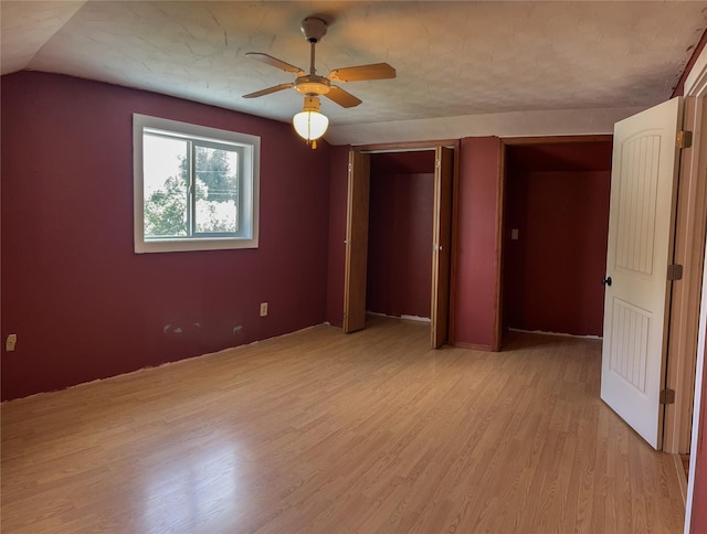 613 Minnesota Ave, Libby, MT 59923 - unfurnished bedroom with light wood-type flooring and a ceiling fan